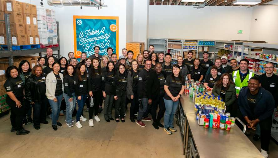 A group of people with containers of food
